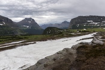 Snow on landscape with mountain in the background, Logan Pass, Glacier National Park, Glacier County, Montana, USA
