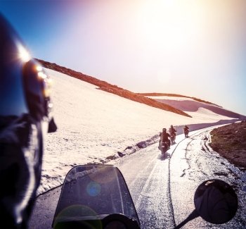 Group of bikers on snowy road, active lifestyle, adventure trip, extreme  moto sport, off-road transport, race competition, speed concept