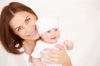 Closeup portrait of beautiful young mother carry cute little baby girl, at home, healthy childhood, new life concept