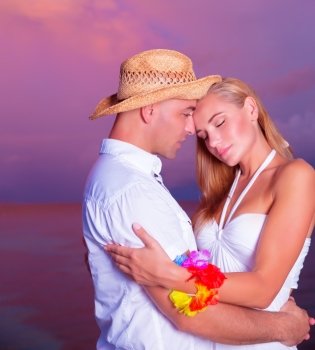 Wedding on the beach, happy couple embracing, closeup faces portrait of a young beautiful people, luxury resort on an island, new family enjoying sunset, honeymoon vacation on Maldives