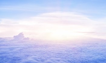 Beautiful heaven in the morning, flying over fluffy clouds, bright sun light, peaceful landscape, good weather, freedom concept