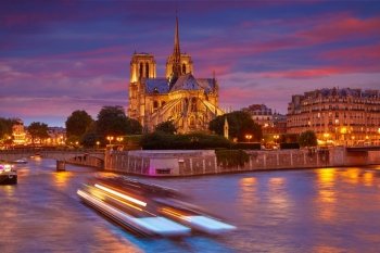 Notre Dame cathedral in Paris sunset from Seine river in France