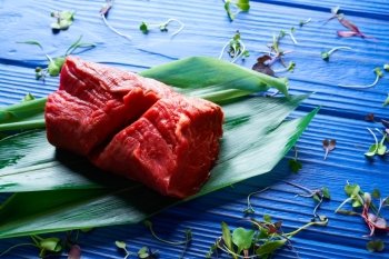 Beef meat loaf Veal loin on blue wood background