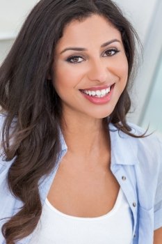 Portrait of a beautiful young Latina Hispanic woman smiling with perfect teeth