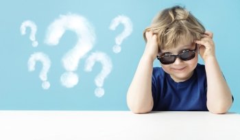 Cute little boy with questions