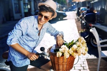 Handsome young guy with a stylish bike