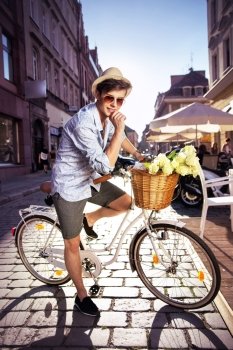 Smart guy riding a retro bicycle