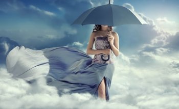 Attractive lady walking on the clouds