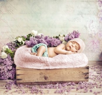 Sleeping toddler lying on purple flowers and blanket
