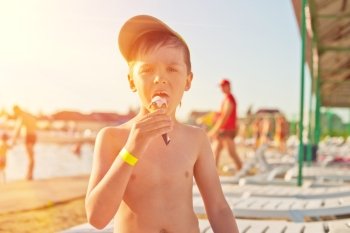  ice-cream. Baby boy with ice-cream at the beach