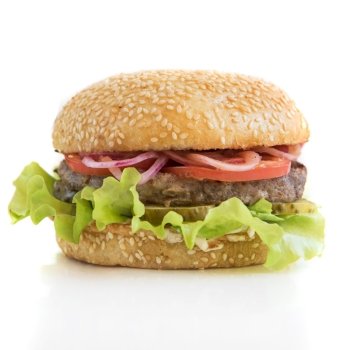 Tasty classical burger with meat cheese lettuce onion, tomato isolated on white