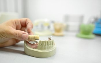 Dental technician working in dental laboratory