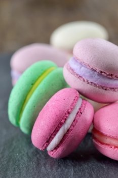 Colorful macaroons on ardesia stone plate