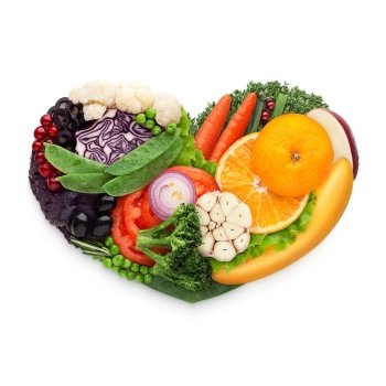 Healthy food concept of a human heart made of vegetable and fruit mix that reduce death risk, isolated on white.