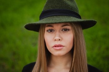 Portrait of a pretty girl wearing hat 