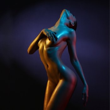 fashion art photo of sexy nude stripper in the night-club. Perfect female body  with oil skin