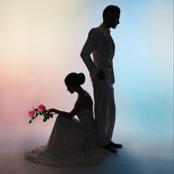 Art fashion studio photo of wedding couple silhouette groom and bride on colors background. Art Wedding style. Flowing dress. Dance of groom and bride