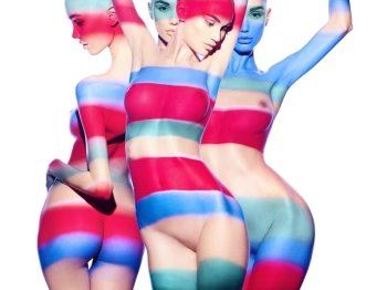 Fashion art studio photo of four sensual naked ladies with color shadows on their bodies