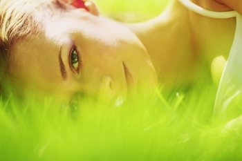 woman lay on grass close up. woman lay on grass