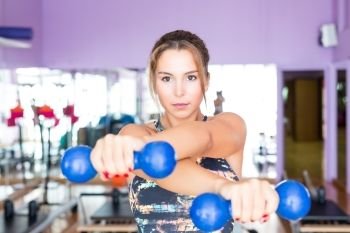 Young woman getting into shape with one more training session 