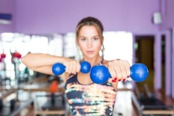 Young woman getting into shape with one more training session 