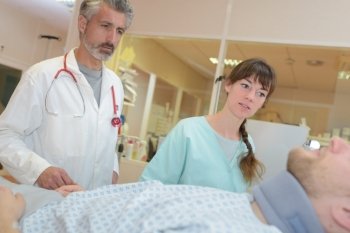 doctor and nurse interacting with each other in hospital room