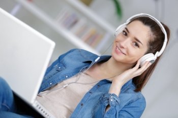 woman listening to music on her laptop