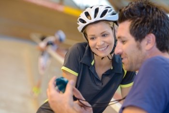 Cyclist pleased with time on stopwatch