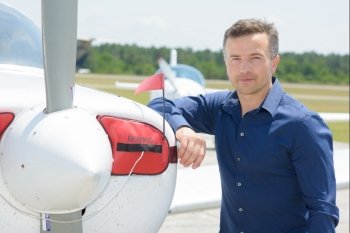 Portrait of man next to aircraft