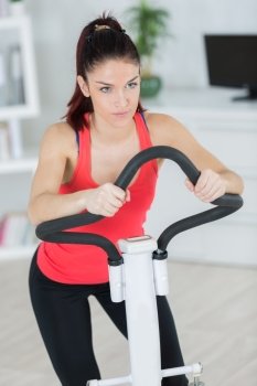 Woman on indoor exercise machine