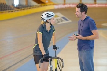 Coach motivating cyclist