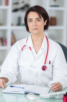 portrait of young female doctor in her office