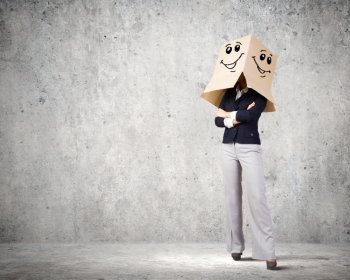 With mask on face. Conceptual image of businesswoman with carton box on head