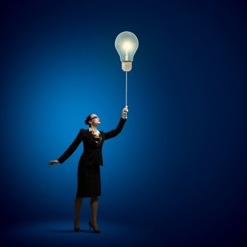 Strategy concept. Image of businesswoman holding bulb balloon. idea concept