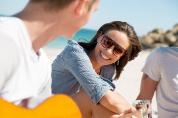 Beautiful young people with guitar on beach. Beautiful young people with guitar having fun on beach