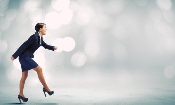 Business start. Side view of businesswoman standing in start position