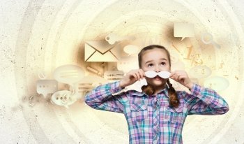 Kid with mustache. Cute girl wearing shirt and paper mustache