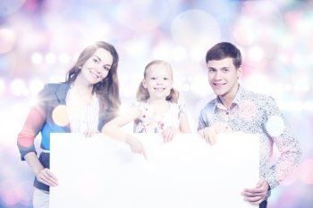 Happy family. Young happy family with white blank banner. Place for text
