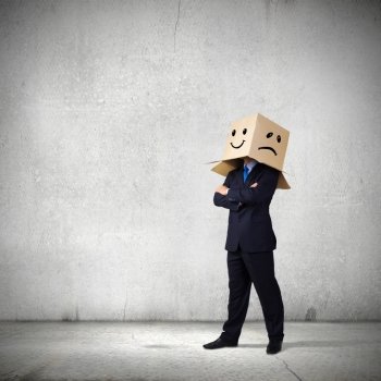 Mood change. Businessman with box on head showing different emotions