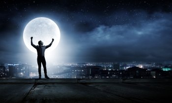 Man and full moon. Young man at night with big full moon at background