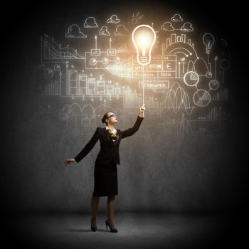 Strategy concept. Image of businesswoman holding bulb balloon with sketch at background