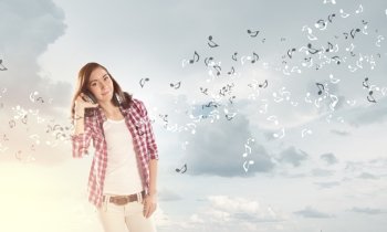 Music lover. Young pretty girl in casual with headphones listen to music