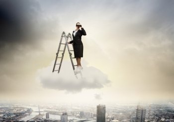 Business vision. Image of businesswoman standing on ladder and looking in binoculars