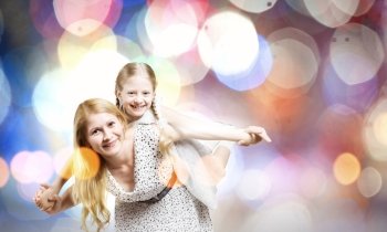 Mother and daughter. Happy family of mother and daughter against bokeh background