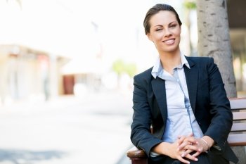 Portrait of business woman smiling outdoor. Portrait of young business woman outdoors