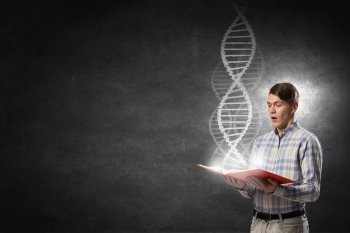 Guy with book in hands. Young student guy with book in hands and DNA molecule on pages