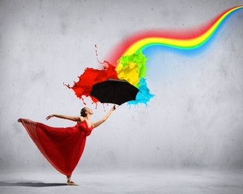 Ballet dancer in flying silk dress with umbrella. ballet dancer in flying satin dress with umbrella and a rainbow