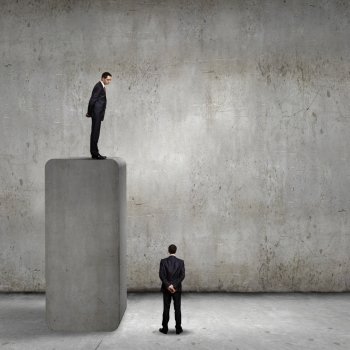Progress in business. Businessman standing on bar and looking down at colleague