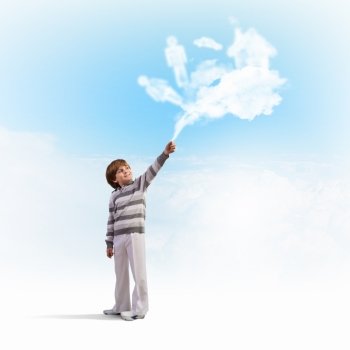 Cute boy catching clouds. Image of little cute boy catching clouds in sky