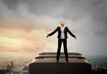 Businesswoman in despair. Image of businesswoman on top of building screaming